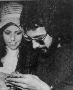 Cat Stevens signing autograph for young fan.